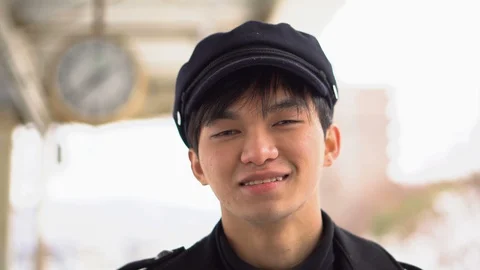2 Clips - Happy Smiling Young Japanese Man At Train Station With Clock Stock Footage 101002143