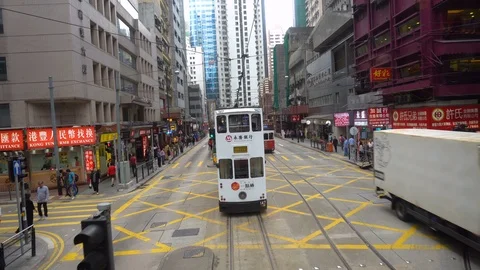 2 Clips - Hong Kong Tram Driving Through Busy Street - Partial Time Lapse - Hong Stock Footage 90125883