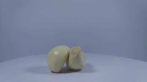 2 clove of garlic from the front Stock Footage 329623240
