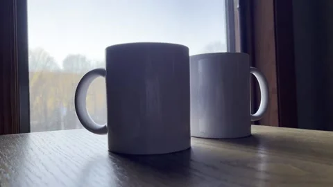 2 Coffee Mugs on Table Stock Footage 225954437