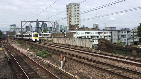 2 commuter trains passing each other on the approach to London, UK Stock Footage 81195760