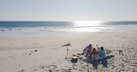 2 couples enjoying day at a beach Vídeo Stock 125872254