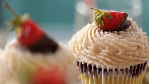 2 Cupcakes Focus moves Backward Closeup Stock Footage 99164546