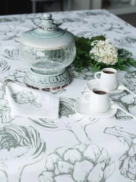 2 cups of coffee on the table, thuja twigs, white flower Stock Photos