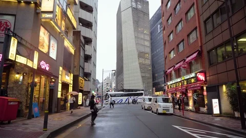 2 Different Streets - Gimbal Walking in Middle of Road in Downtown Tokyo Stock Footage 104472149