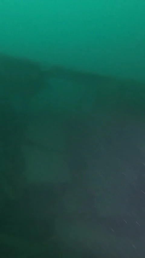 2 divers explore a large shipwreck Stock Footage 277228416