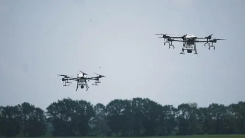 2 drones for irrigation on the farm field Stock Footage 255621082