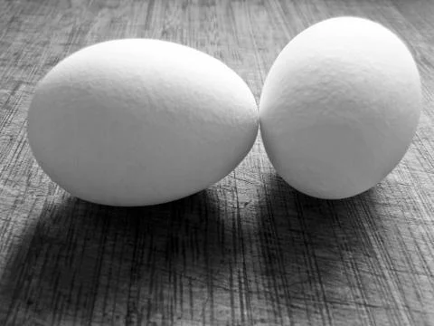 2 eggs with clipping path, one stands up the other lay down Stock Photos