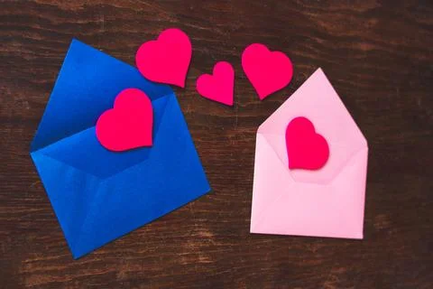 2 envelopes exchanging hearts Stock Photos