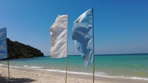 2 Flags on the beach, blue and white - SLOW MOTION Stock Footage 148282983