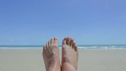 2 foots closeup on the white sand beach blue sky and sea Video stock 280867060