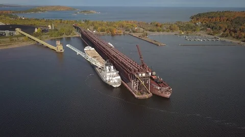 2 freighters and ore dock and power plant Stock Footage 100128568
