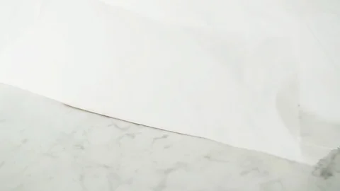 2 fresh Sea Mackerel fillets opened from grease-proof paper on marble. Stock Footage 92145018