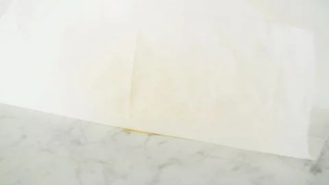 2 fresh smoked haddock fillets opened from grease-proof paper on marble. Stock Footage 92145135