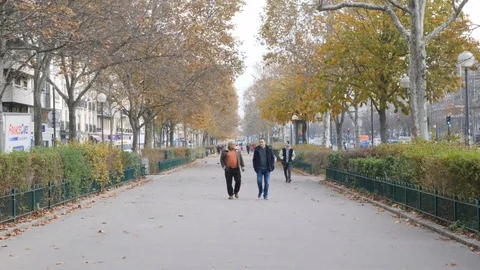 2 friends walking on the Cours de Vincennes in Paris, France Stock Footage 100073991
