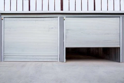 2 gray iron shutter door? of garage and industrial building warehouse. Stock Photos