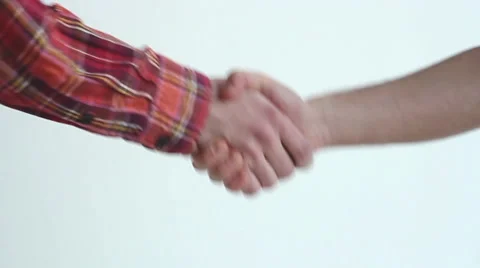 2 guys shake hands at a white background in slow morion Stock Footage 45440788