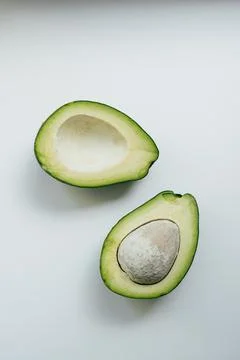 2 half of avocado isolated on a white background Stock Photos