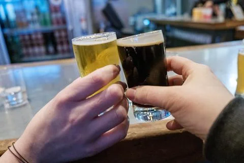 2 hands with glasses, cheers Stock Photos