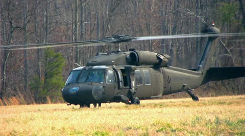 2 helos 1 takes off Stock Footage 1128877