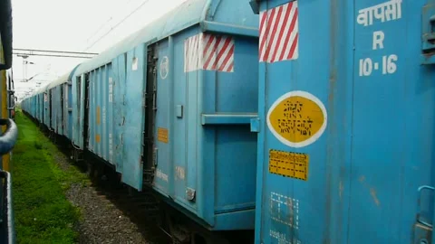 2 Indian passenger &amp; old freight train moving Together parallel in Mumbai India Stock Footage 139325959