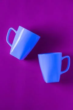 2 isolated blue winter coffee cup mugs for a break time meeting; Copyspace wi Stock Photos