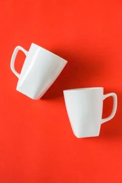 2 isolated white winter coffee cup mugs for a break time meeting; Copyspace w Stock Photos