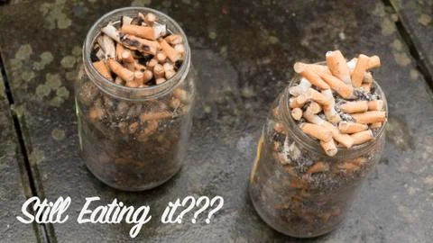 2 jars full with cigarettes. Quit smoking. Stock Photos