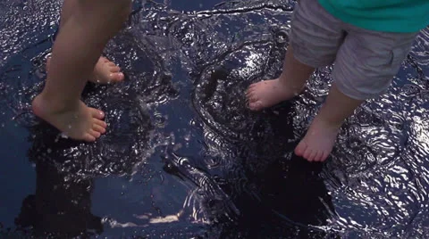 2 Kids Jumping in a Puddle in Slow Motion Stock-Footage 26450039