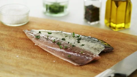 2 Mackerel fillets on a wooden board. Slight camera slide Stock Footage 92147341
