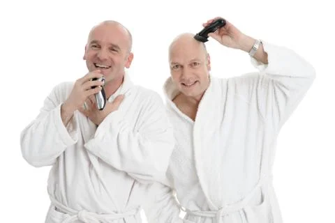 2 Man in front of a mirror shaving Stock Photos