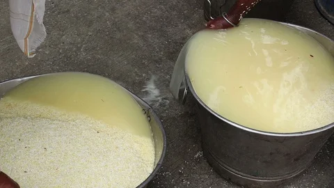 2-man-washes-rice-in-India Stock Footage 93378711