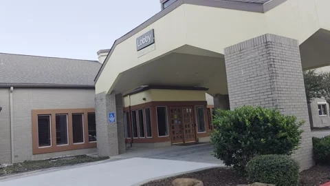 2 May 2024 Dallas, Texas - Walking Extended Stay Hotel Building Stock Footage 325059272