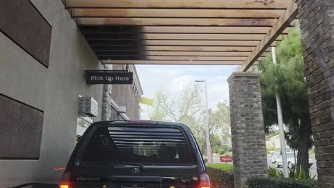 2 May 2024 Miami, Florida - Driving McDonald's Fast Food Drive Thru Stock Footage 332675313