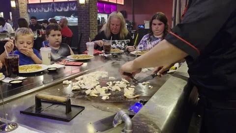 2 May 2024 Orlando, Florida - Eating Japanese Food Steak House Meal Stock Footage 337318372