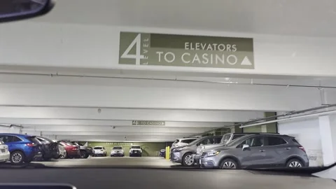 2 May 2024 Seattle, Washington - Driving Parking Garage Casino Building Stock Footage 338406975