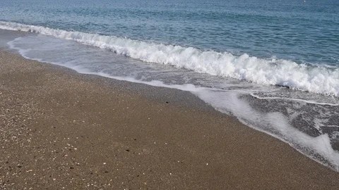 2 Mediterranean sea beach waves reaching shore white foam in Malaga Spain Stock Footage 100632751