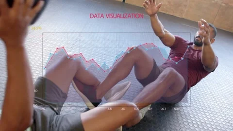 2 men doing situps starting passes lifting medicine ball as overlay data chart Stock Footage 334204017