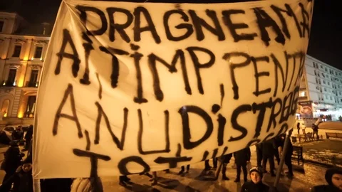 2 men holding big protest sign Stock Footage 90126193