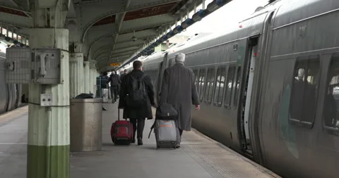 2 men walking to train Stock Footage 239359638