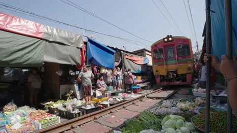 2 November 2022.Train track pass through fresh market, Maeklong Railway Market 動画素材 220948123