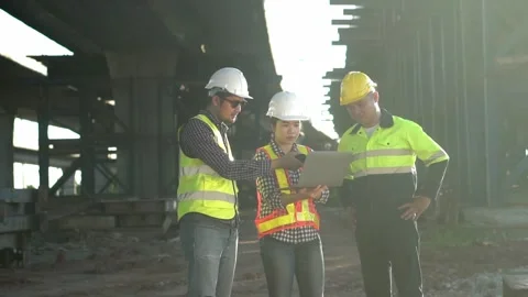 2 people engineer and  1 people  foreman checking working on tollway road  .. Stock-Footage 246350059
