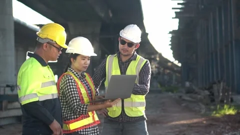 2 people engineer and  1 people  foreman checking working on tollway road  .. Stock Footage 246350065