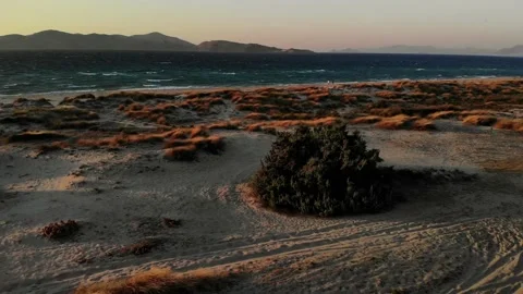 2 People on natural beach during sunset on windy day Stock Footage 138086009