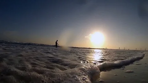 2 people in ocean Stock Footage 97185527