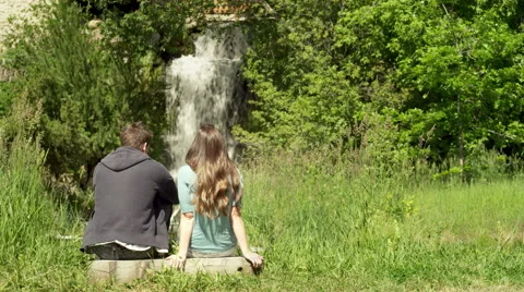 2 People Sit in Front of Waterfall Stock Footage 46832290