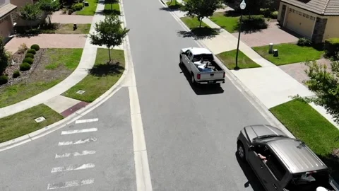 2 pick-ups driving in an American street Video stock 158745017