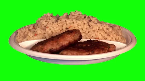 2 pork chops, rice with vegetables on throwaway plate Video stock 47554755