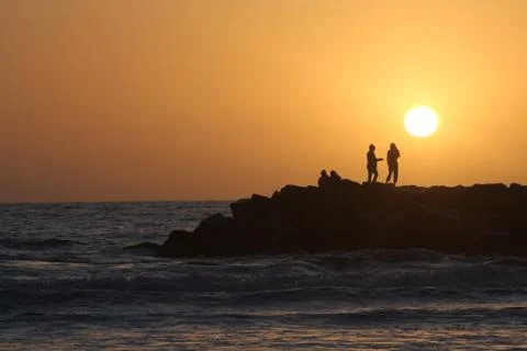 2 on rocks distant Stock Photos