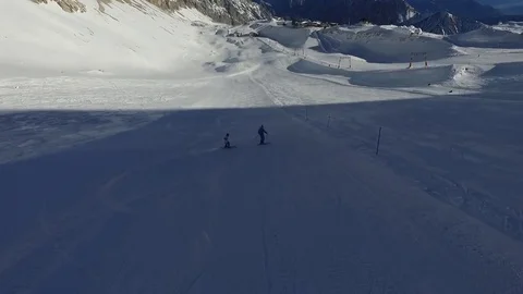 2 Skiers down the Slope Stock Footage 77677385